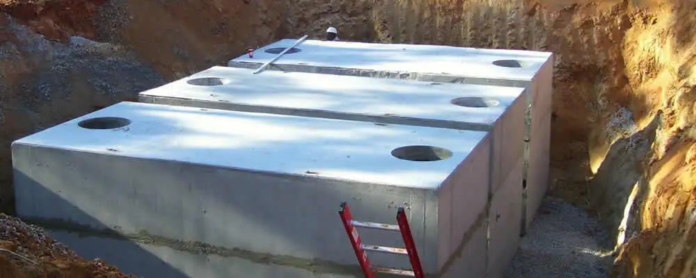 Septic tank installation site with a newly placed concrete tank in Hoboken, NJ